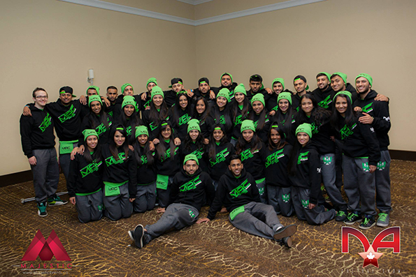 Group of dancers representing their school wearing embroidered toques and custom sweatshirts.