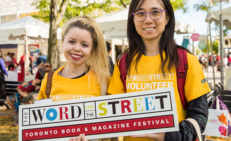 The Word on the Street volunteers wearing yellow custom printed t-shirts at the annual festival.