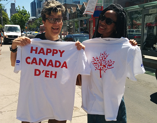 Canada Day custom t-shirts given out to people walking on the street in Toronto.