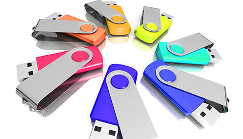 Colourful flash drives used as custom promo products as giveaways for employees or clients.