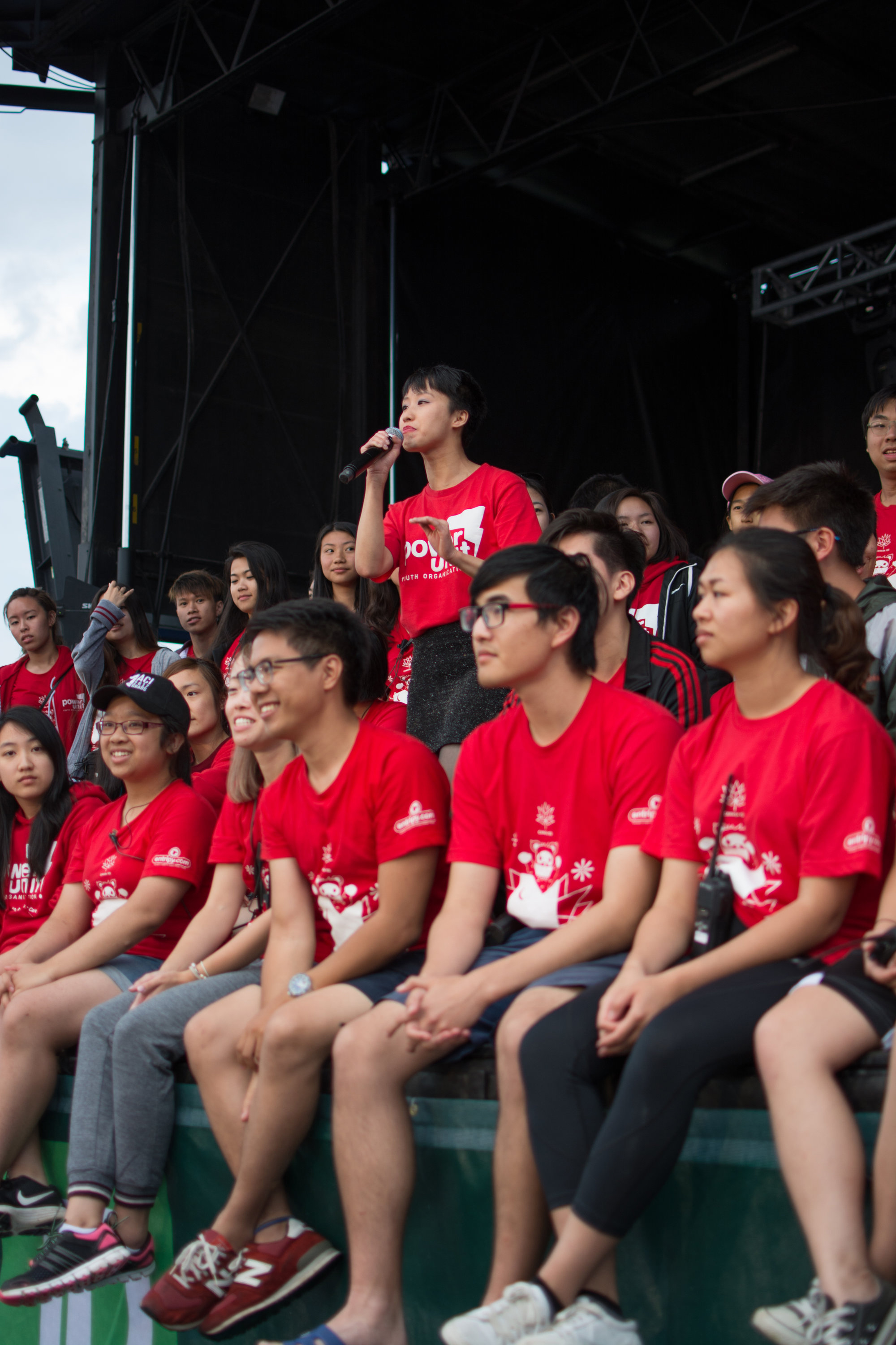 Group of participants at a charity event wearing red custom printed t-shirts.