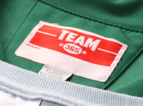Team 365 custom apparel showing a sewn in custom label for added comfort.