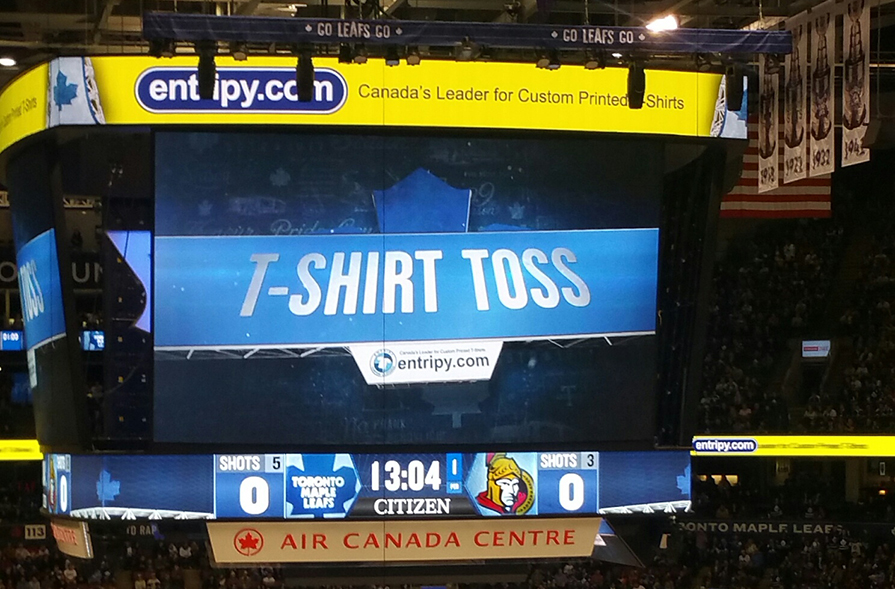 Toronto Maple Leafs in-game Entripy T-Shirt Toss. Custom t-shirts supplied to MLSE as the exclusive promotional partner.