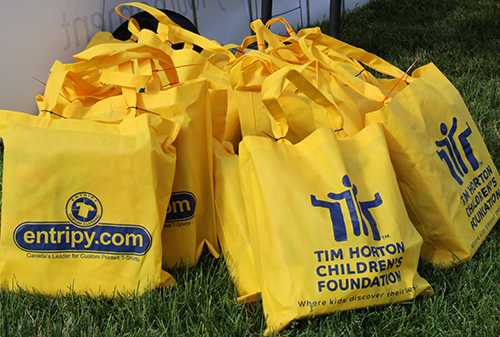 custom tote bags printed with entripy.com logo and Tim Hortons children's foundation charity for giveaways.