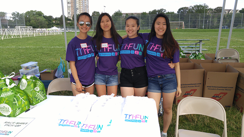 Entripy clients wearing customized t-shirts for a charity event with kids.