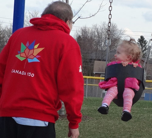 Red custom sweatshirt with full colour Canada150 logo.
